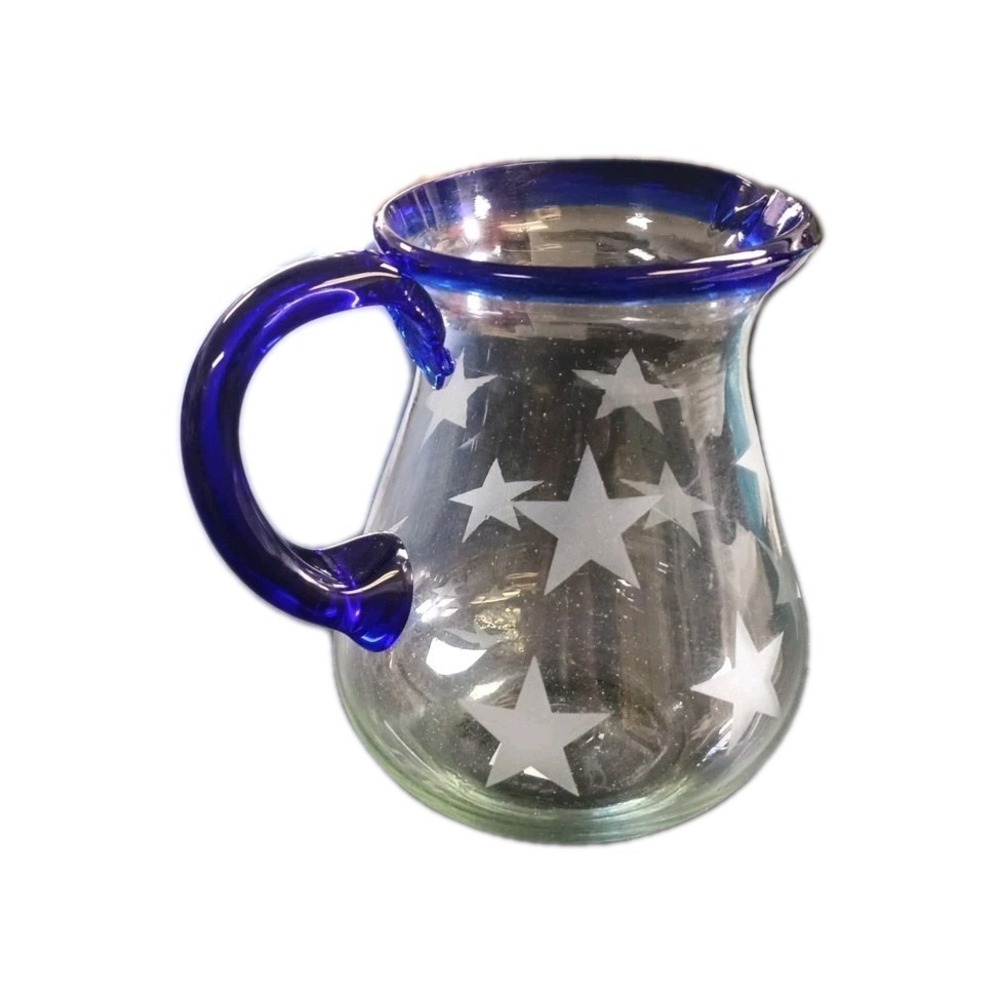 Glass Pitcher With Etched Stars And A Blue Handle